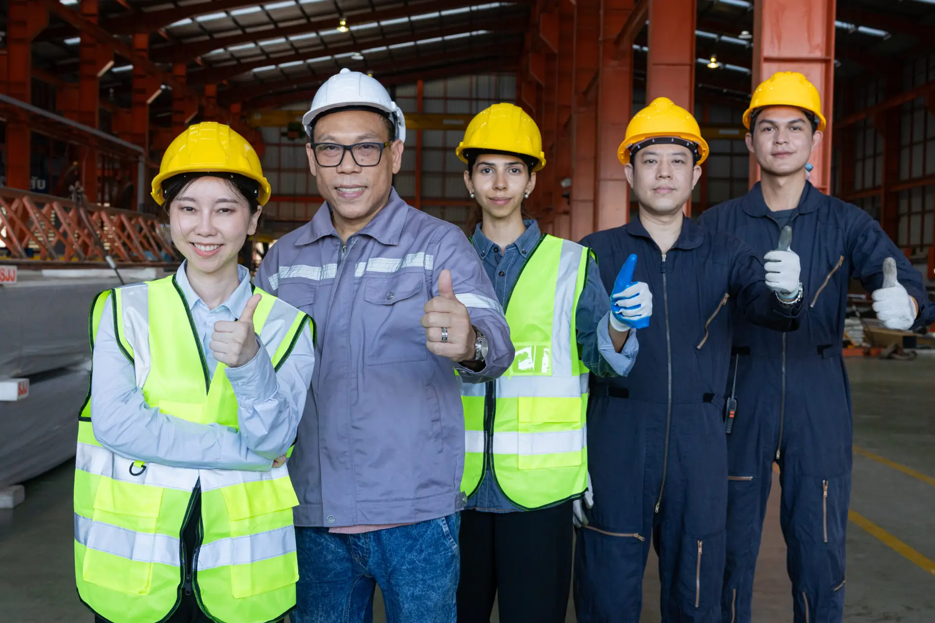 Portrait of people and team of engineers, technicians who are confident in the factory for the service of the production line and pride in the profession. Smiles, employees and arms crossed with the team leader. About Us